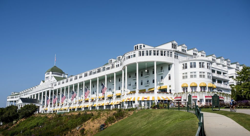 a large white building with a flag on the front