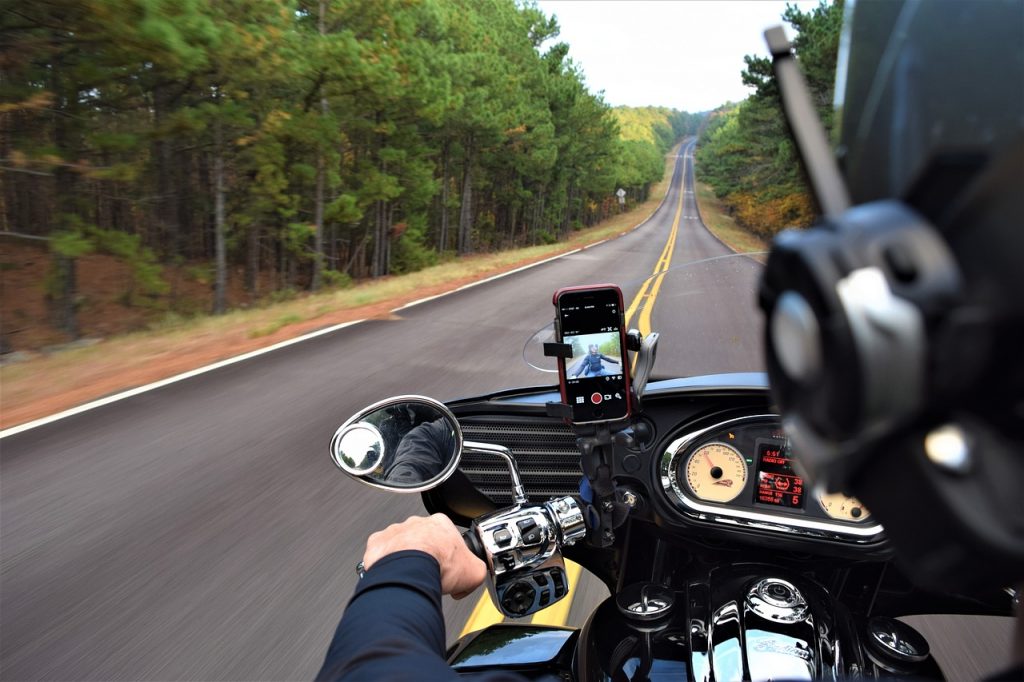 a motorcycle driving down a road