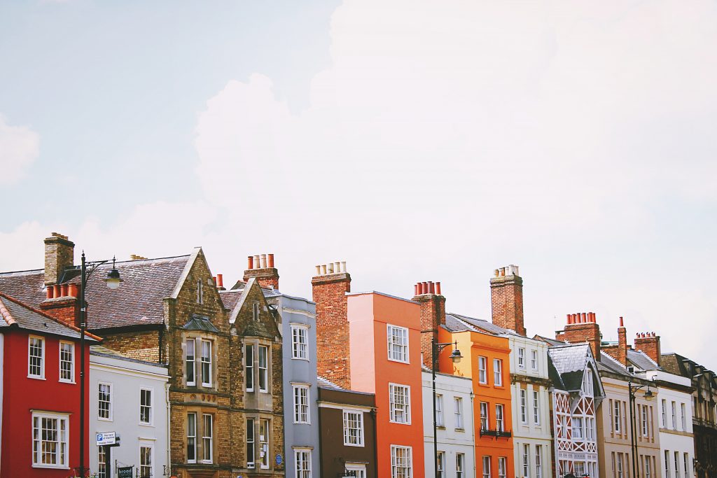 a group of buildings with a cloudy sky