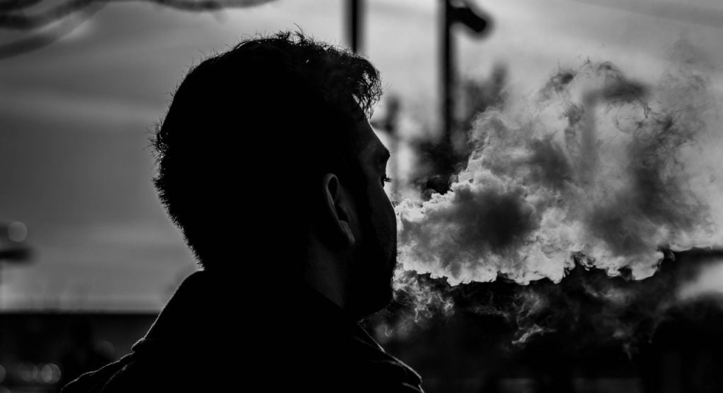 a person looking at smoke