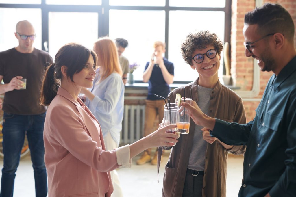 a group of people holding drinks