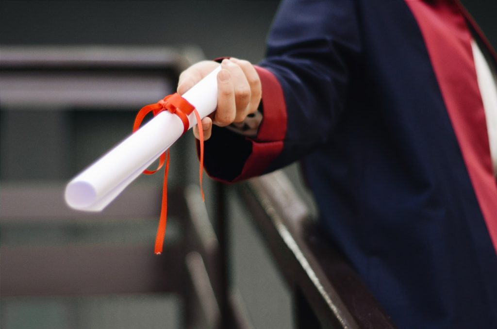 a hand holding a syringe