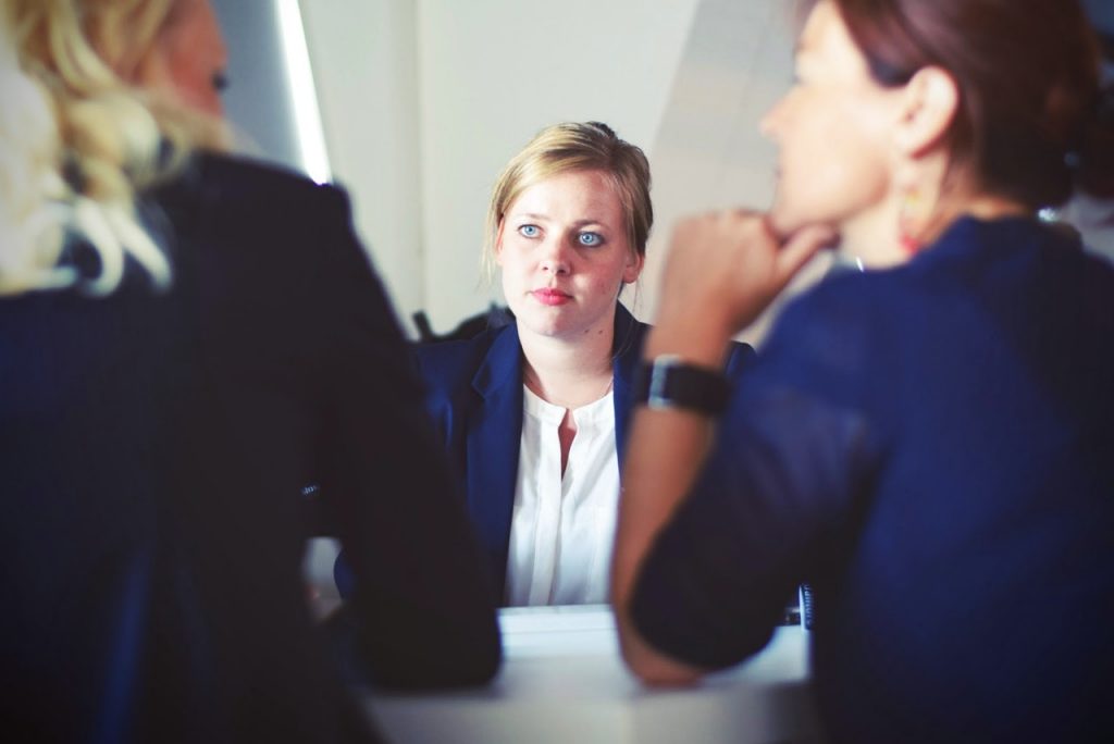 a woman looking at a man