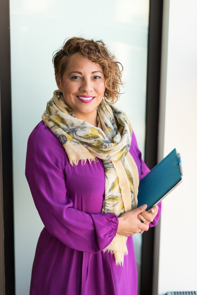 Ramona Ortega holding a book