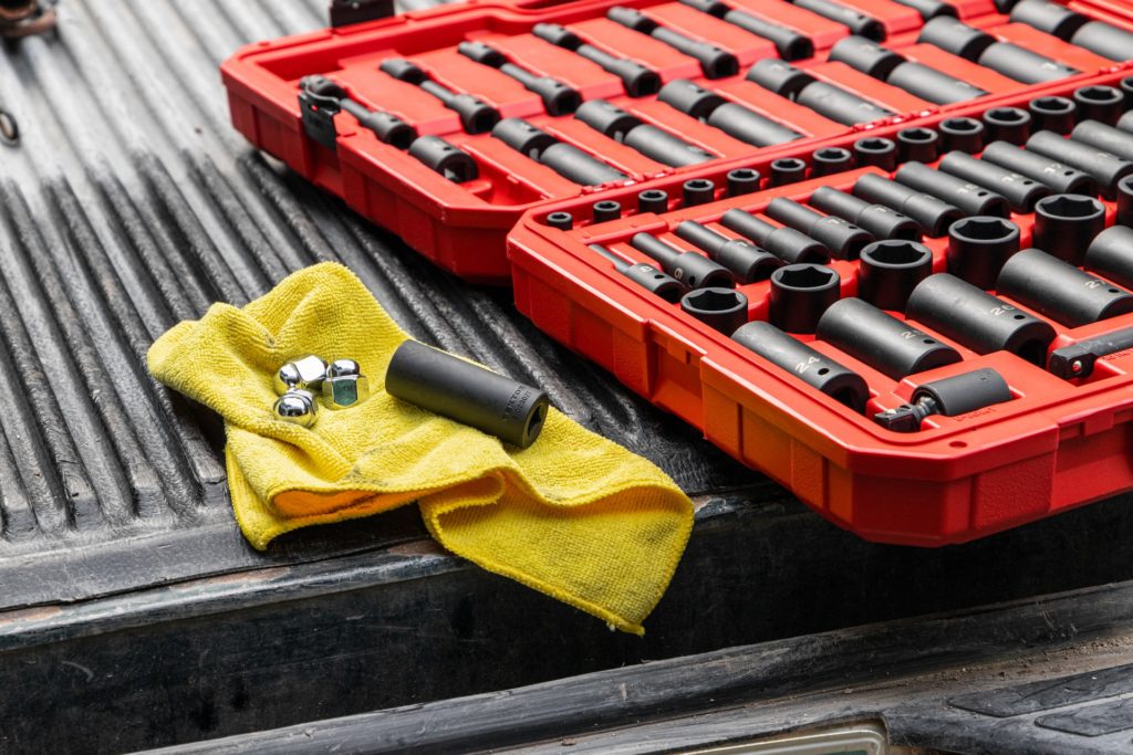 a yellow toy car next to a red keyboard