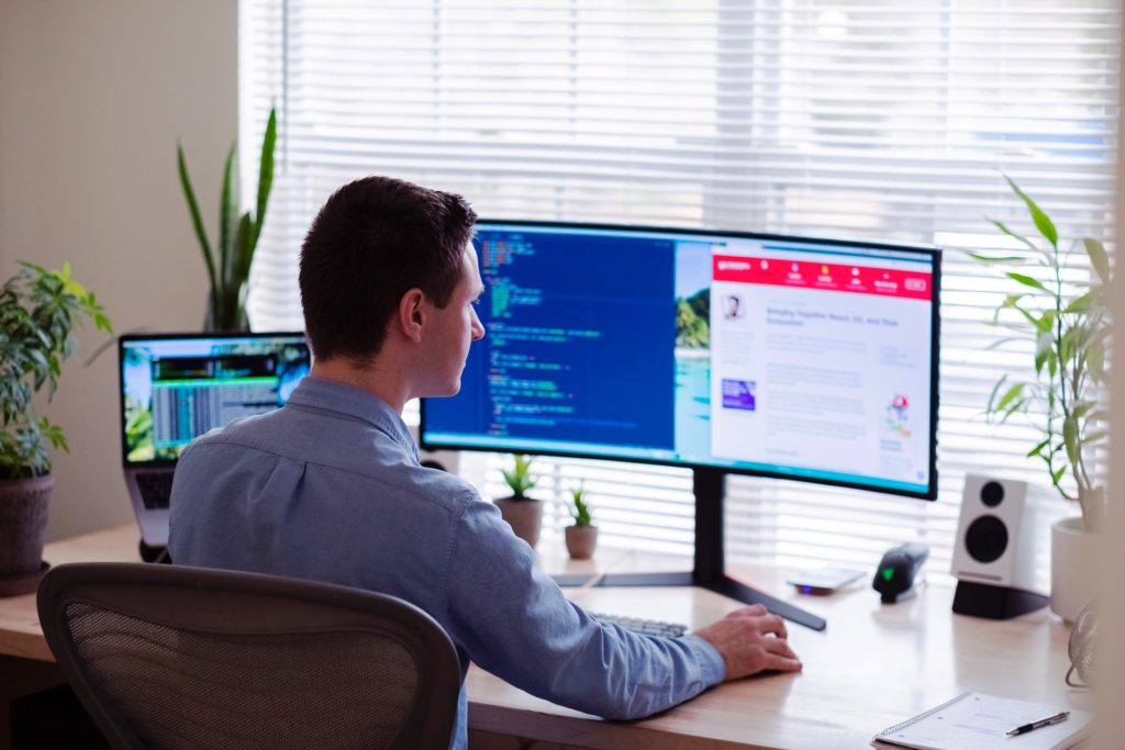 a person sitting in front of a computer