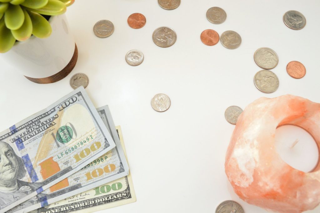 a close-up of a bag of money and coins