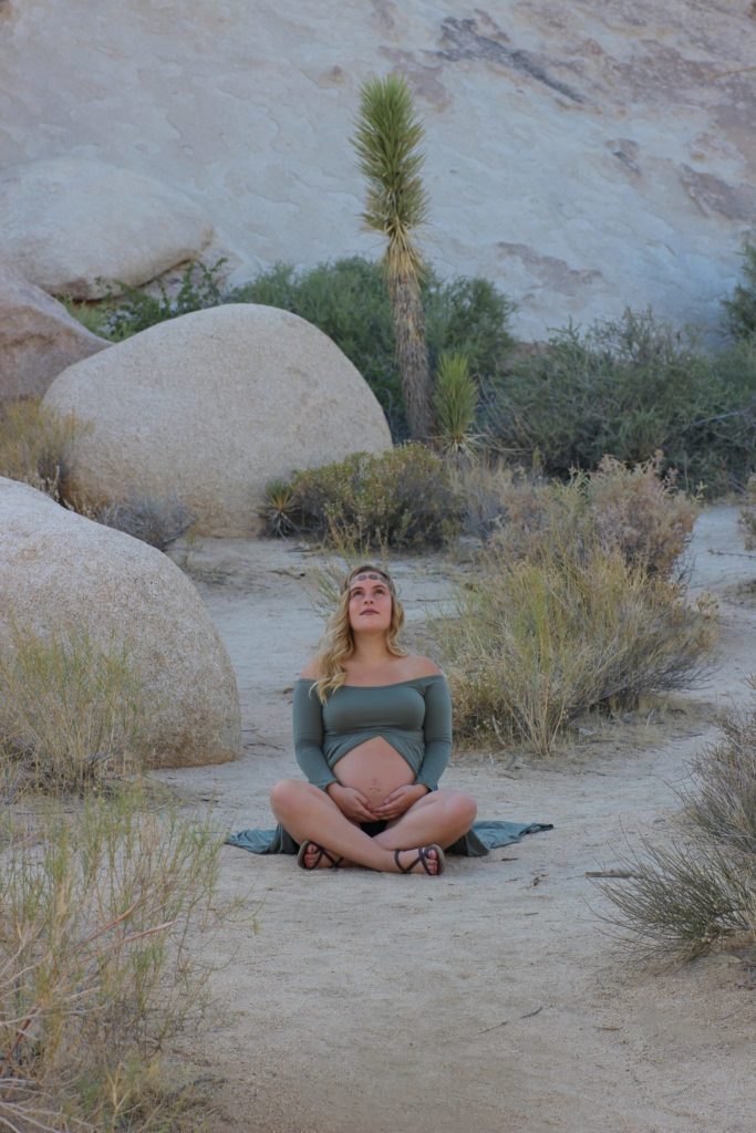 a person sitting on a rock