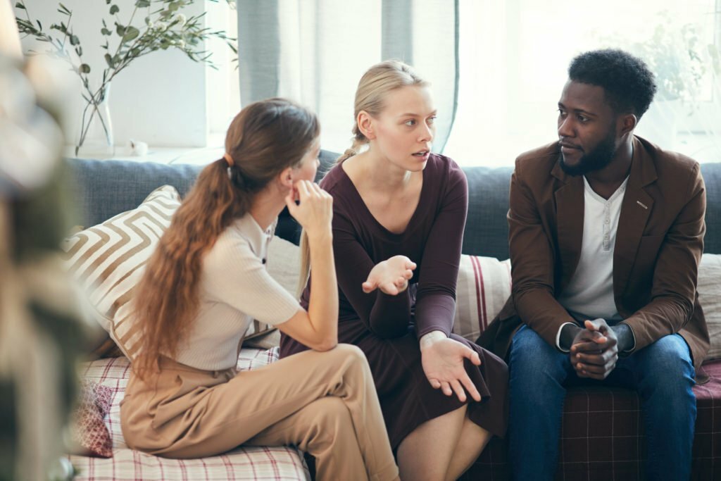 a group of people sitting on a couch